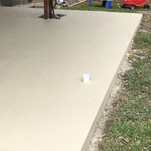Concrete patio floor in an Austin, TX home after completing repair project and fixing epoxy coating.