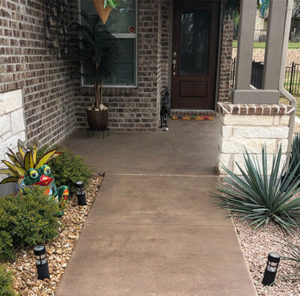 Residential entrance area after completing a concrete resurfacing project in Austin, TX.
