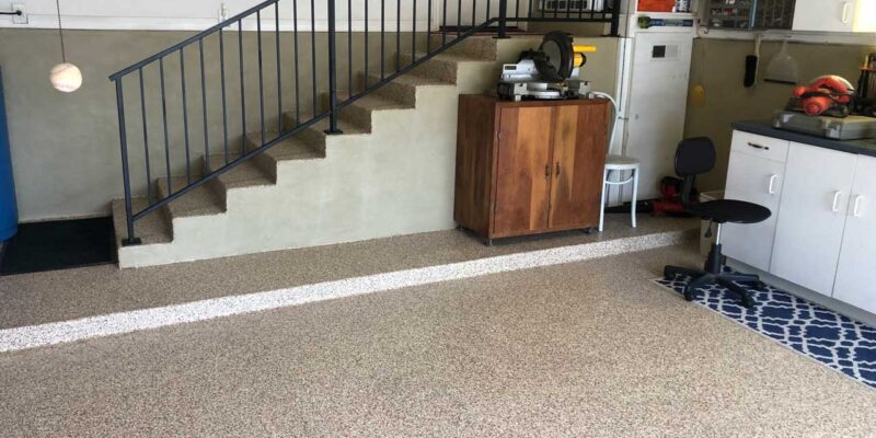 Indoor residential concrete staining on floors and stairs in an Austin, TX house.