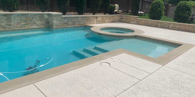 A shot of the results of our resurfacing pool decks service outside a home in Austin, TX.