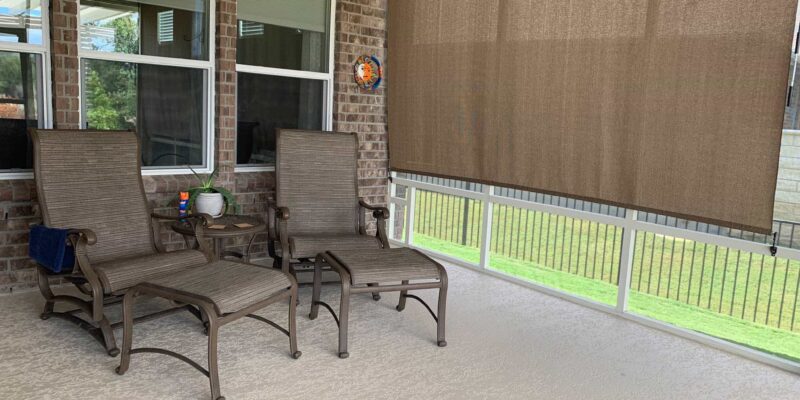 Concrete coatings over a patio in an Austin, TX home with a brown shade.