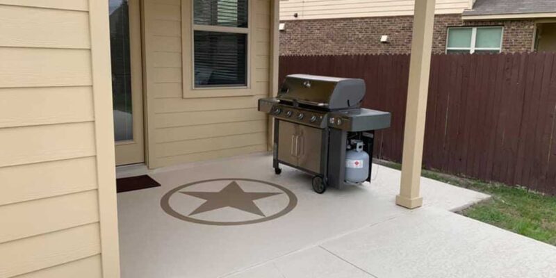 Concrete patio coating with a decorative appearance outside a home in Austin, TX.