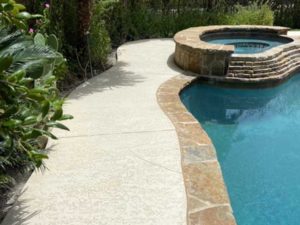 Example of a cool pool deck coating in the backyard of an Austin, TX home.