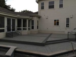 A look at the results of a patterned pool patio resurfacing in a home in Austin, TX.