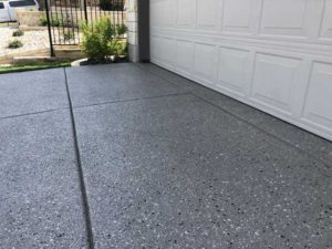 Driveway of an Austin, TX home after completing concrete overlay project.