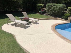 Appealing concrete pool deck resurfacing work in an Austin, TX home done by us.