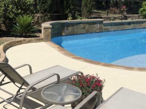 Concrete pool deck of residential property in Austin, TX after professional resurfacing