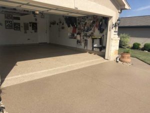Residential garage after installing floor coating from our team serving Austin, TX and nearby areas.