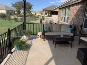 Residential outdoor area in Austin, TX upon completing a concrete patio restoration project.