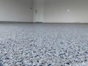 Closeup on the garage floor in an Austin, TX home after quality resurfacing
