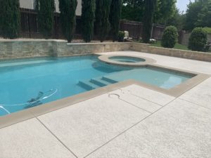 Pool deck after installing one of the outdoor concrete coatings in an Austin, TX home.