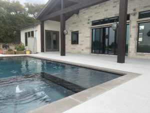 Concrete pool resurfacing with a white, clean look in an Austin, TX home.