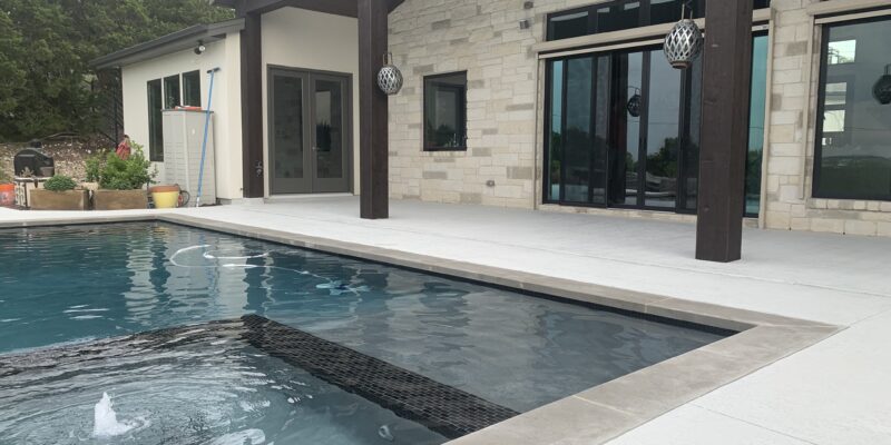Concrete pool resurfacing with a white, clean look in an Austin, TX home.