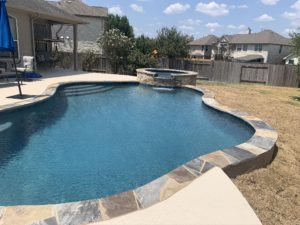 Austin, TX home and backyard after Suncoat of Texas has resurfaced concrete around the pool.