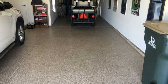 Image of a garage with vehicles parked. Your search for “garage floor coating near me” ends here.