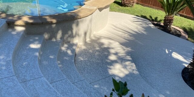 Complete pool patio resurfacing includes the stairs and the area around the swimming pool