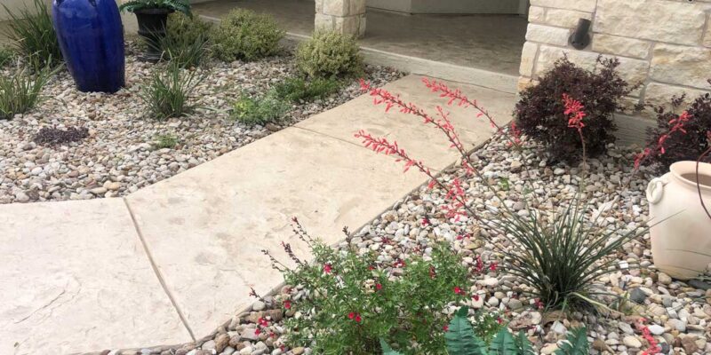 A white textured decorative walkway in your garden adds a classy touch to your outdoor area