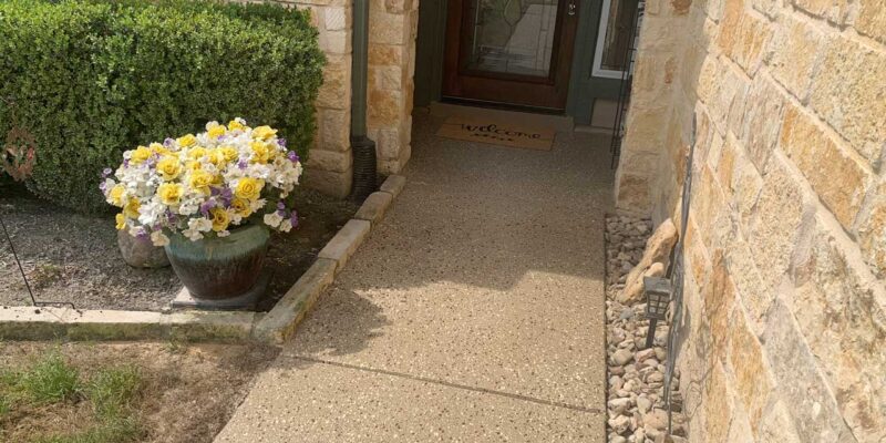 A decorative walkway leading to the home's entrance, crafted with precise attention to detail
