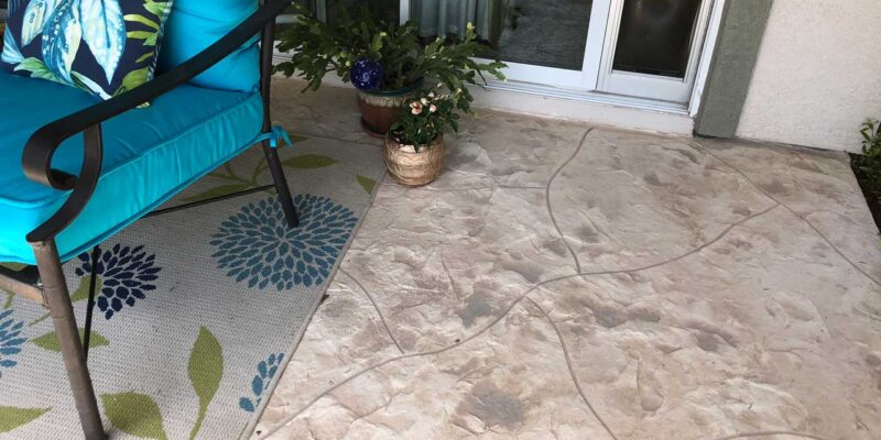 A porch floor after stamped concrete services with patterns is done.
