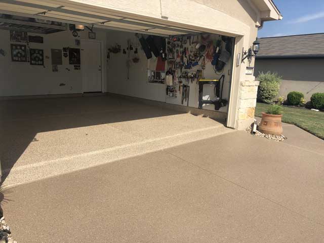 As seen from the outside, a concrete garage floor coating has transformed our client's garage space.